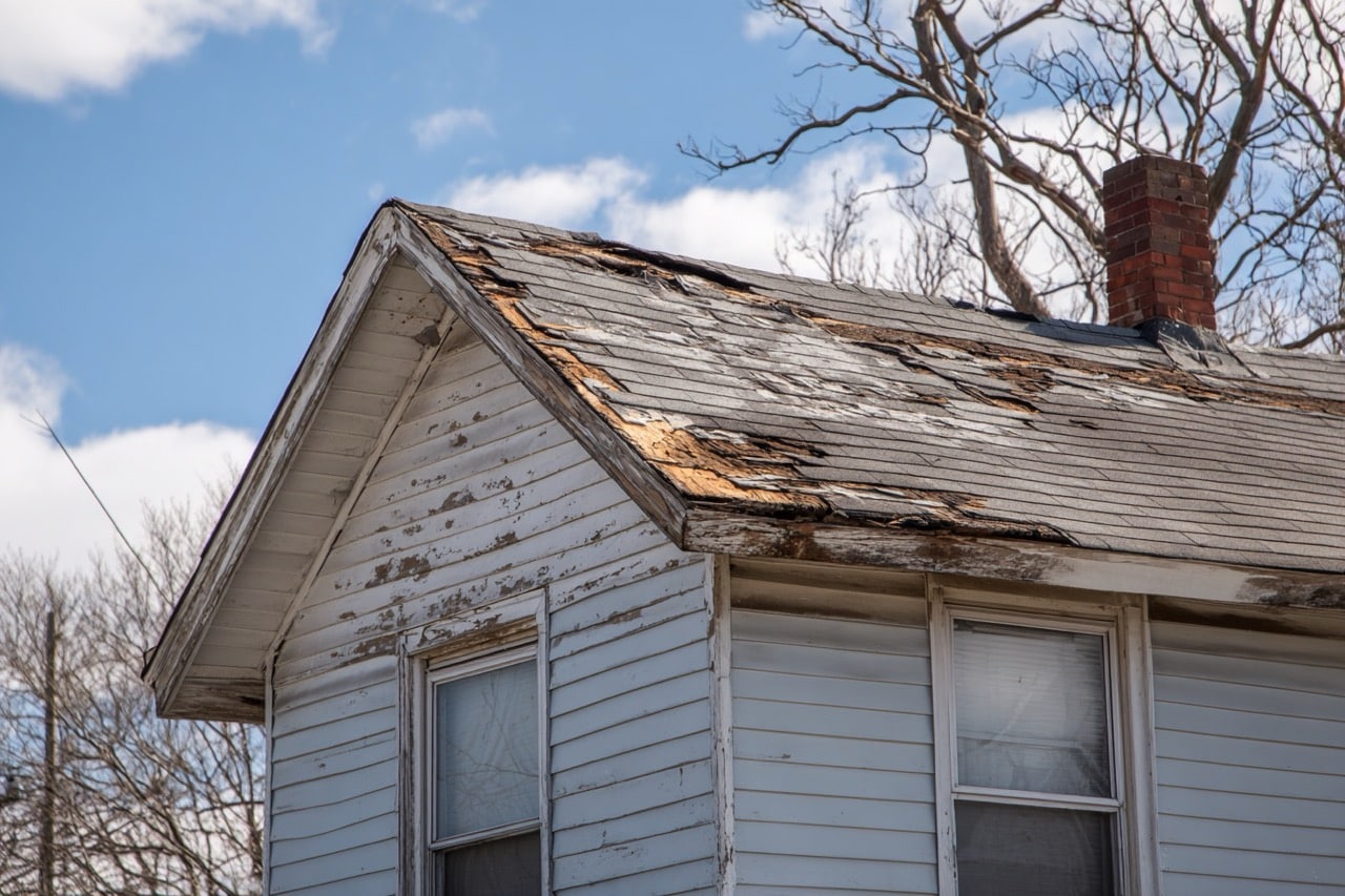 House with storm damaged roof in St Louis Missouri requiring repairs